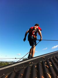 Gutter vacuum on a high building Gutter vacuum on a high building